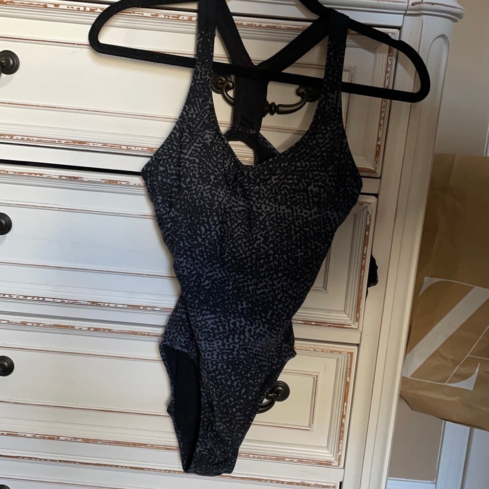 Size 4 one piece speedo. Worn only twice!